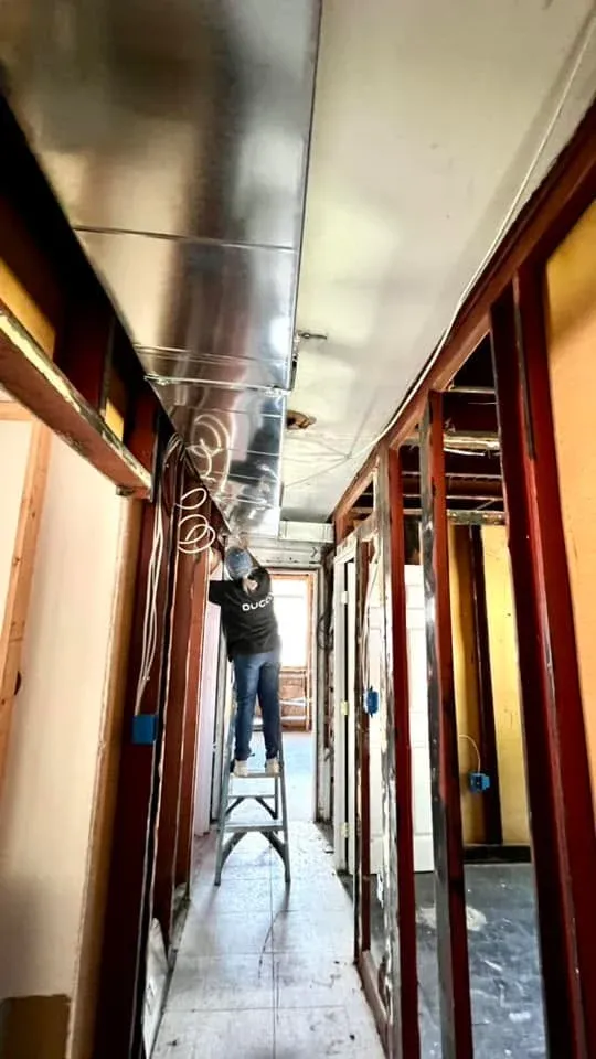 Ducco technician installing ductwork